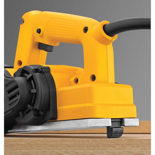DEWALT Portable Hand Planer placed on a plank of wood