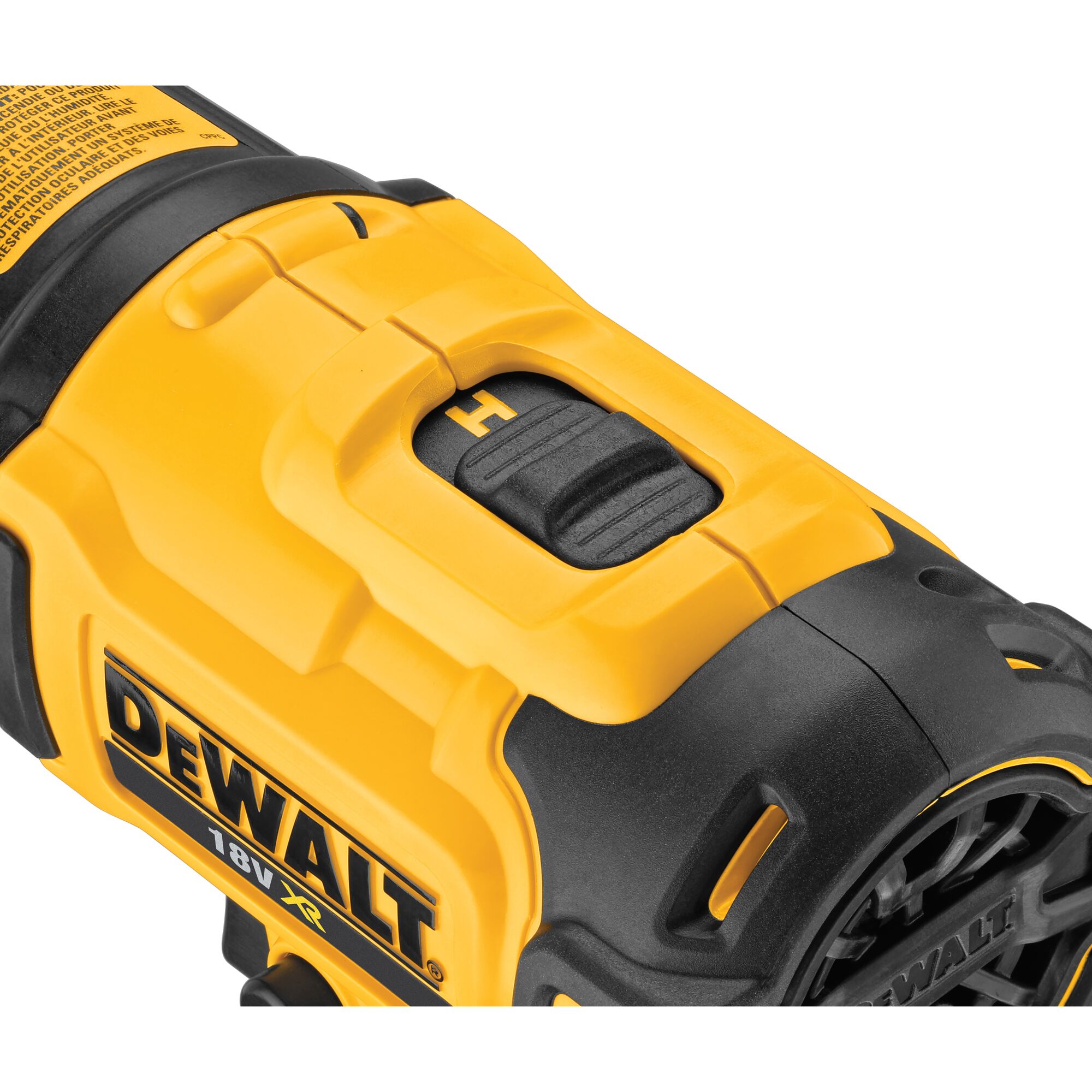 Close-up of a yellow and black DeWalt 18V XR power tool, showing a textured switch and part of the tool's vented housing.