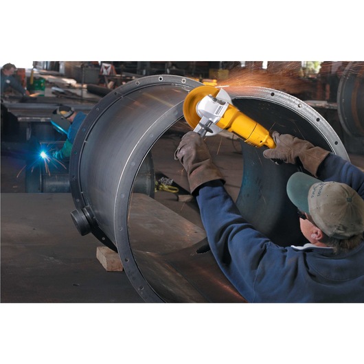 7 inch / 180 millimeter Medium Angle Grinder being used on giant metal structure.